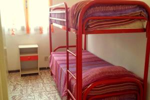 a couple of bunk beds in a room at Nettuno 9C in Lido di Pomposa