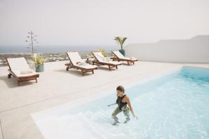 a young boy playing in a swimming pool at Villa Atlantis I in La Asomada