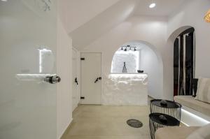 
a bathroom with a sink, toilet, and bathtub at Saint George Hotel in Naxos Chora
