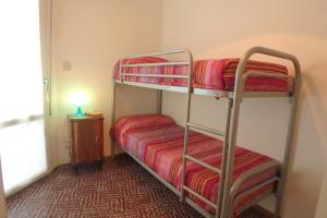 A bed or beds in a room at Nettuno 137D
