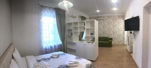 TV a/nebo společenská místnost v ubytování Apartment on Sumskaya no smoking