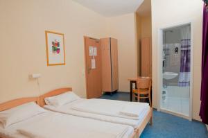 Postel nebo postele na pokoji v ubytování Happy Hotel Berlin