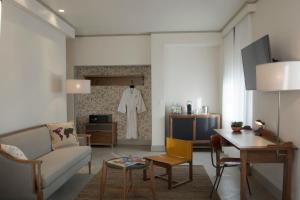 a living room with a couch and a table at Hotel G San Francisco in San Francisco