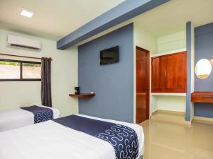 Postel nebo postele na pokoji v ubytování Hotel Pejelagarto