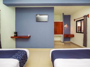 Postel nebo postele na pokoji v ubytování Hotel Pejelagarto
