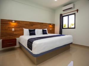 Postel nebo postele na pokoji v ubytování Hotel Pejelagarto