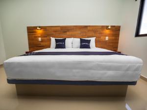 Postel nebo postele na pokoji v ubytování Hotel Pejelagarto