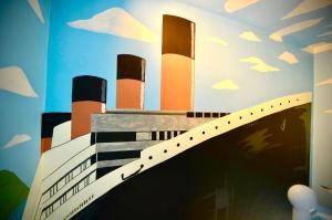 a painting of a building with smoke stacks at Rose Titanic Belfast romantic world in Belfast