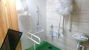 a bathroom with a sink and a toilet at Camping Pod Heaven in Brackla