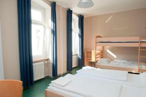 Postel nebo postele na pokoji v ubytování Happy Hotel Berlin