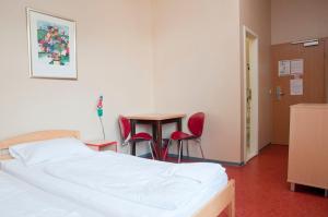 Postel nebo postele na pokoji v ubytování Happy Hotel Berlin