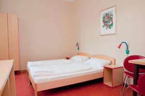 Postel nebo postele na pokoji v ubytování Happy Hotel Berlin