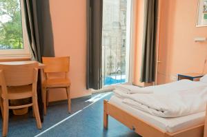 Postel nebo postele na pokoji v ubytování Happy Hotel Berlin