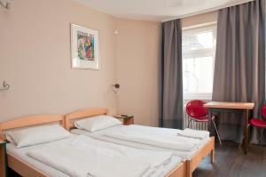 Postel nebo postele na pokoji v ubytování Happy Hotel Berlin