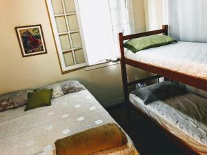 Postel nebo postele na pokoji v ubytování Casarão Vintage Petrópolis - Hostel