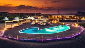 an image of a pool at a resort at night at Keros Blue - Luxury in Wilderness in Kalliópi
