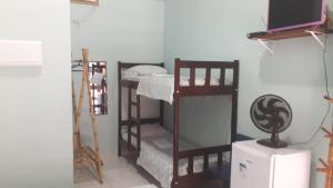 Krevet ili kreveti na kat u jedinici u objektu Aveiro Suítes Boiçucanga Frente ao Mar