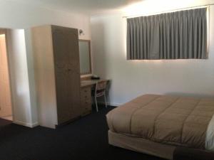 Postel nebo postele na pokoji v ubytování Nunawading Motor Inn