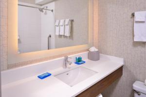 a bathroom with a white sink and a mirror at Holiday Inn Express Walnut Creek by IHG in Walnut Creek +47 photos