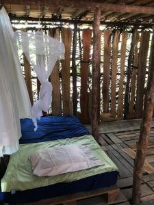 Postel nebo postele na pokoji v ubytování Miguel Surf Camp
