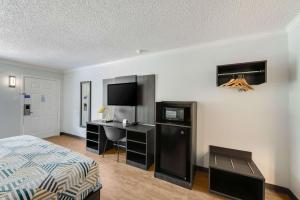 Postel nebo postele na pokoji v ubytování Motel 6-Kilgore, TX