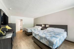 Postel nebo postele na pokoji v ubytování Motel 6-Kilgore, TX