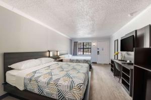 Postel nebo postele na pokoji v ubytování Motel 6-Kilgore, TX