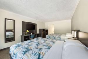 Ένα ή περισσότερα κρεβάτια σε δωμάτιο στο Motel 6-Kilgore, TX