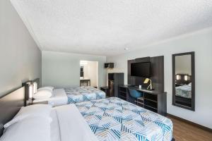 Postel nebo postele na pokoji v ubytování Motel 6-Kilgore, TX