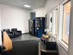 an office with a waiting room with chairs and a table at Motel 6 Missoula, Mt - Wye - Travel Plaza in Missoula