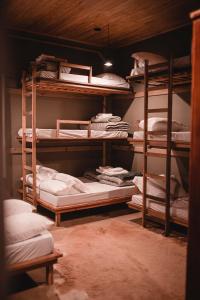 a room with multiple bunk beds in a room at Estalagem Inverness - Morro da Igreja - Urubici in Urubici