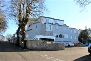 a white van parked in front of a building at The Maycliffe Hotel in Torquay