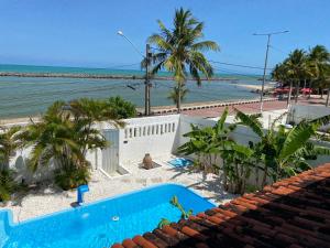 a view of the ocean from the roof of a house at Taverna do Paraiso in Janga