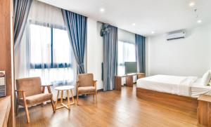 Postel nebo postele na pokoji v ubytování Grand Lee Hotel