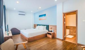 Postel nebo postele na pokoji v ubytování Grand Lee Hotel
