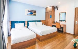 Postel nebo postele na pokoji v ubytování Grand Lee Hotel