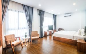 Postel nebo postele na pokoji v ubytování Grand Lee Hotel
