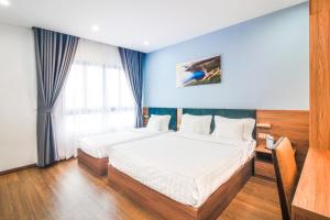 Postel nebo postele na pokoji v ubytování Grand Lee Hotel