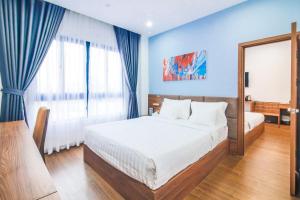 Postel nebo postele na pokoji v ubytování Grand Lee Hotel