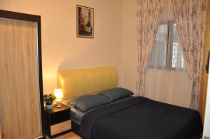 Postel nebo postele na pokoji v ubytování AmySity Homestay Gandaria Modern Lifestyle walking distance to Hub Shopping Centre at Sek 9 Bangi Sentral With Netflix