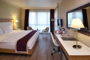 Postel nebo postele na pokoji v ubytování Masel Hotel