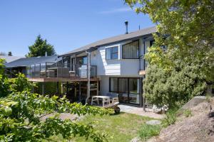 an exterior view of a house with a balcony at Mountain Views, Nice Spot Newly renovated in Lake Tekapo