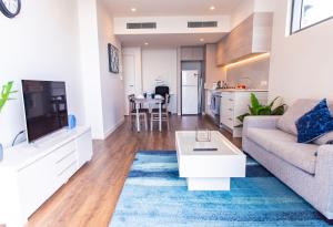 A seating area at AirTrip Apartments at South Brisbane