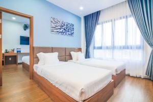 Postel nebo postele na pokoji v ubytování Grand Lee Hotel