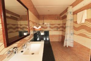 a bathroom with two sinks and a large mirror at Hotel Splendid View in Pokhara +78 photos