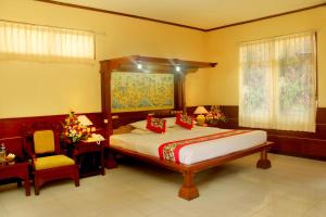 Postel nebo postele na pokoji v ubytování Melasti Beach Resort & Spa Legian