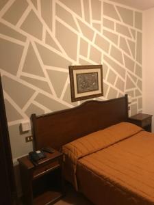 Postel nebo postele na pokoji v ubytování Hotel Chopin