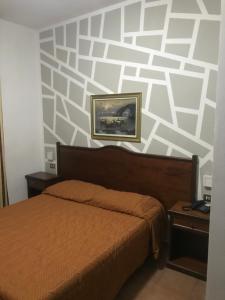 Postel nebo postele na pokoji v ubytování Hotel Chopin