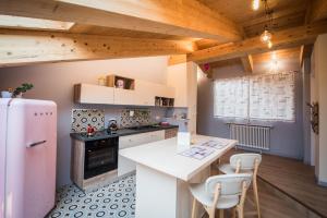 Kuchyň nebo kuchyňský kout v ubytování Loft 29 mansardato con ampio terrazzo