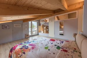 Postel nebo postele na pokoji v ubytování Loft 29 mansardato con ampio terrazzo